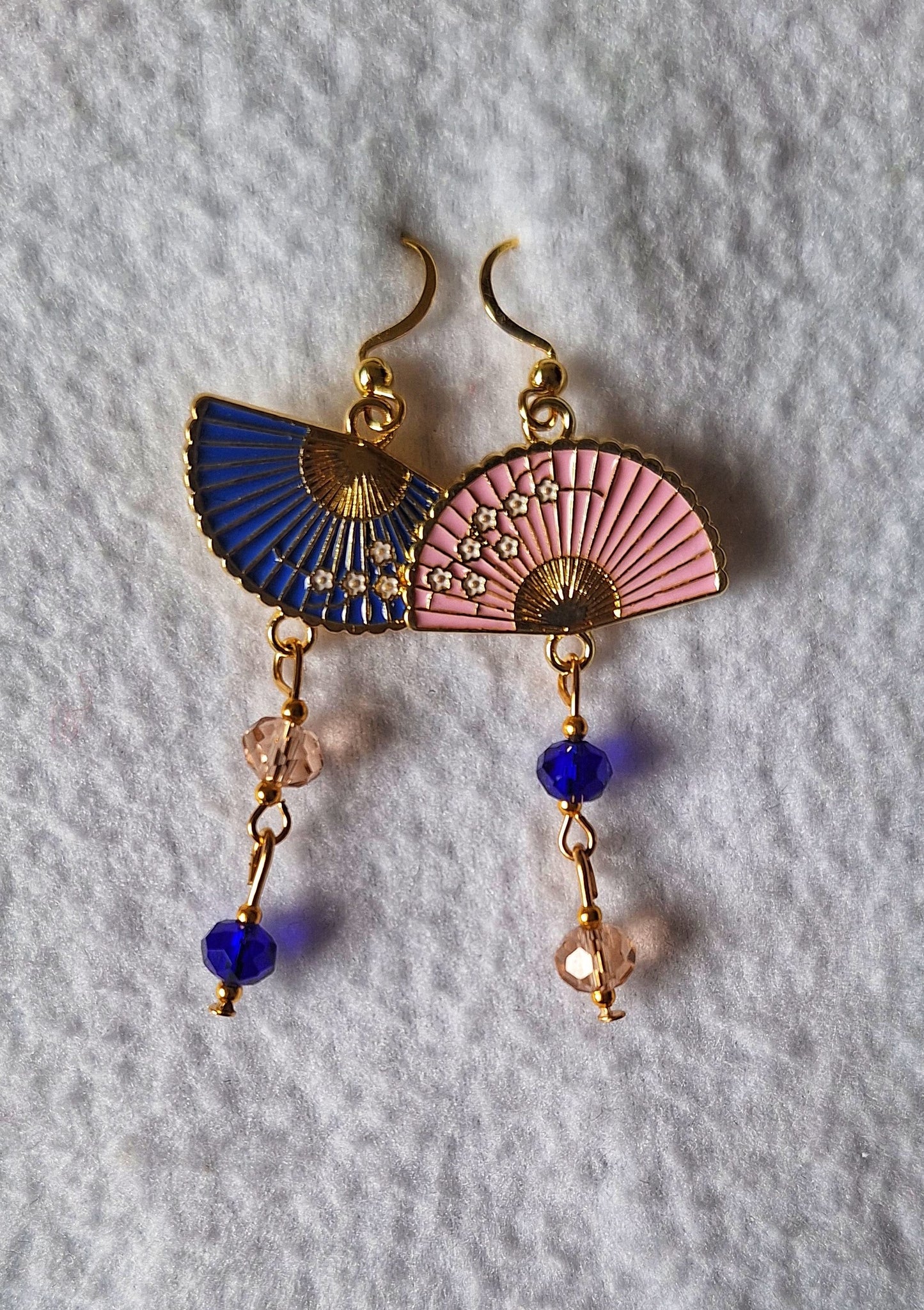 Fumika Fan Earrings with blue and pink fan charms, faceted glass beads, gold-plated hooks on white background.