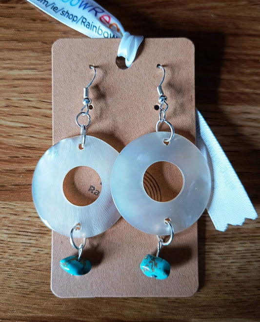 Large shell hoop earrings with turquoise nuggets and silver findings.
