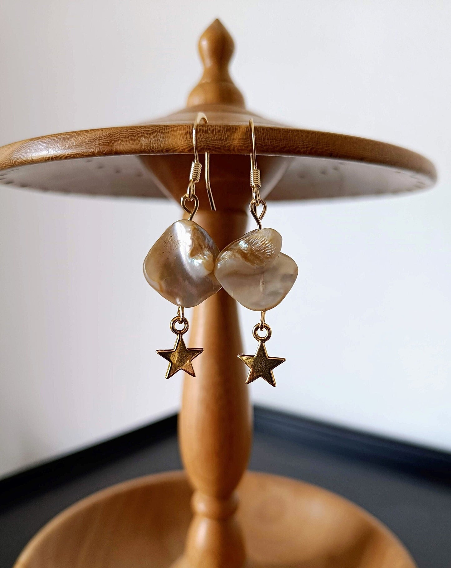 Celeste Gold Star freshwater pearl earrings with antique gold stars and 14K gold plated ear wires.