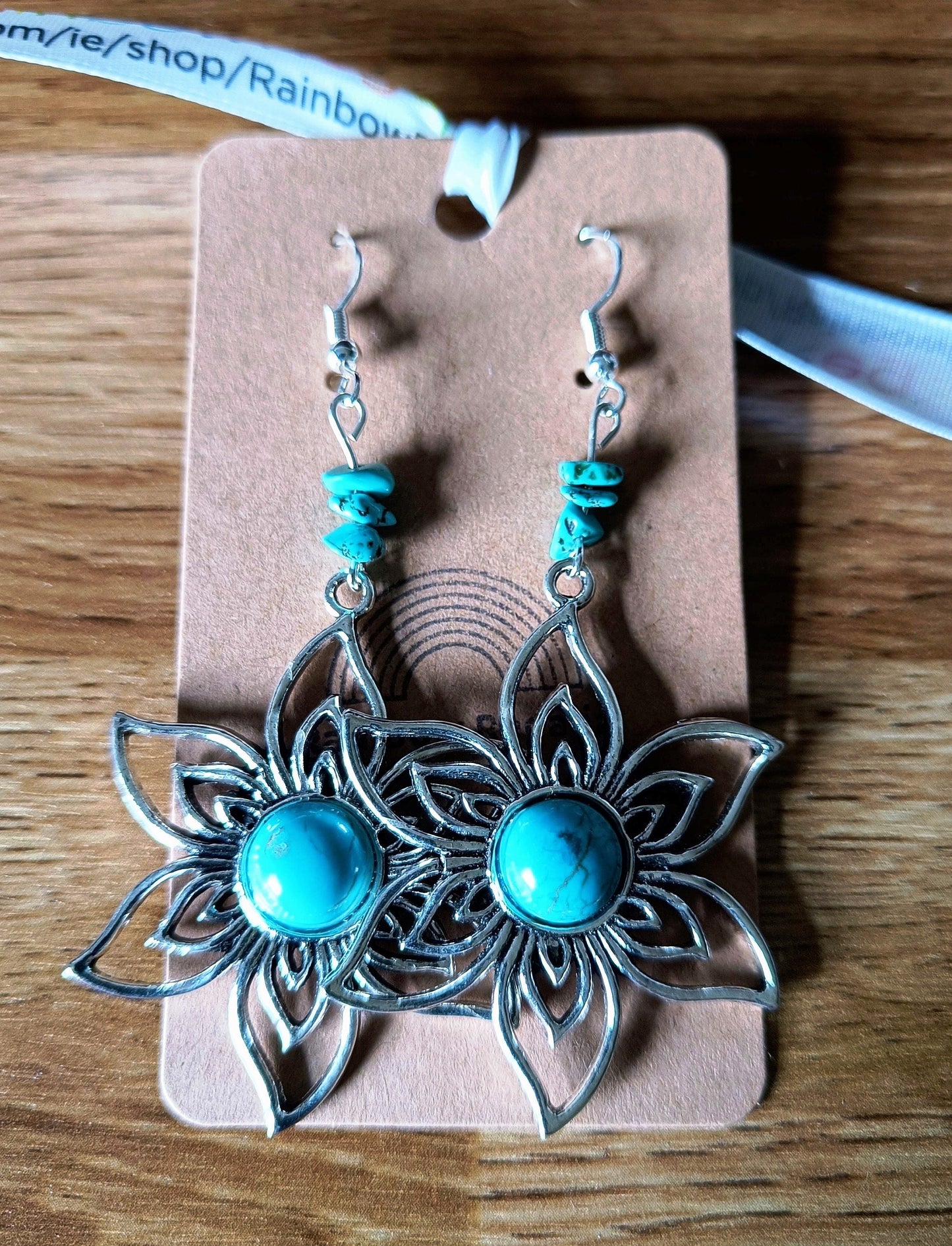 Blossom Turquoise Flower Earrings with Tibetan silver flower and turquoise center.