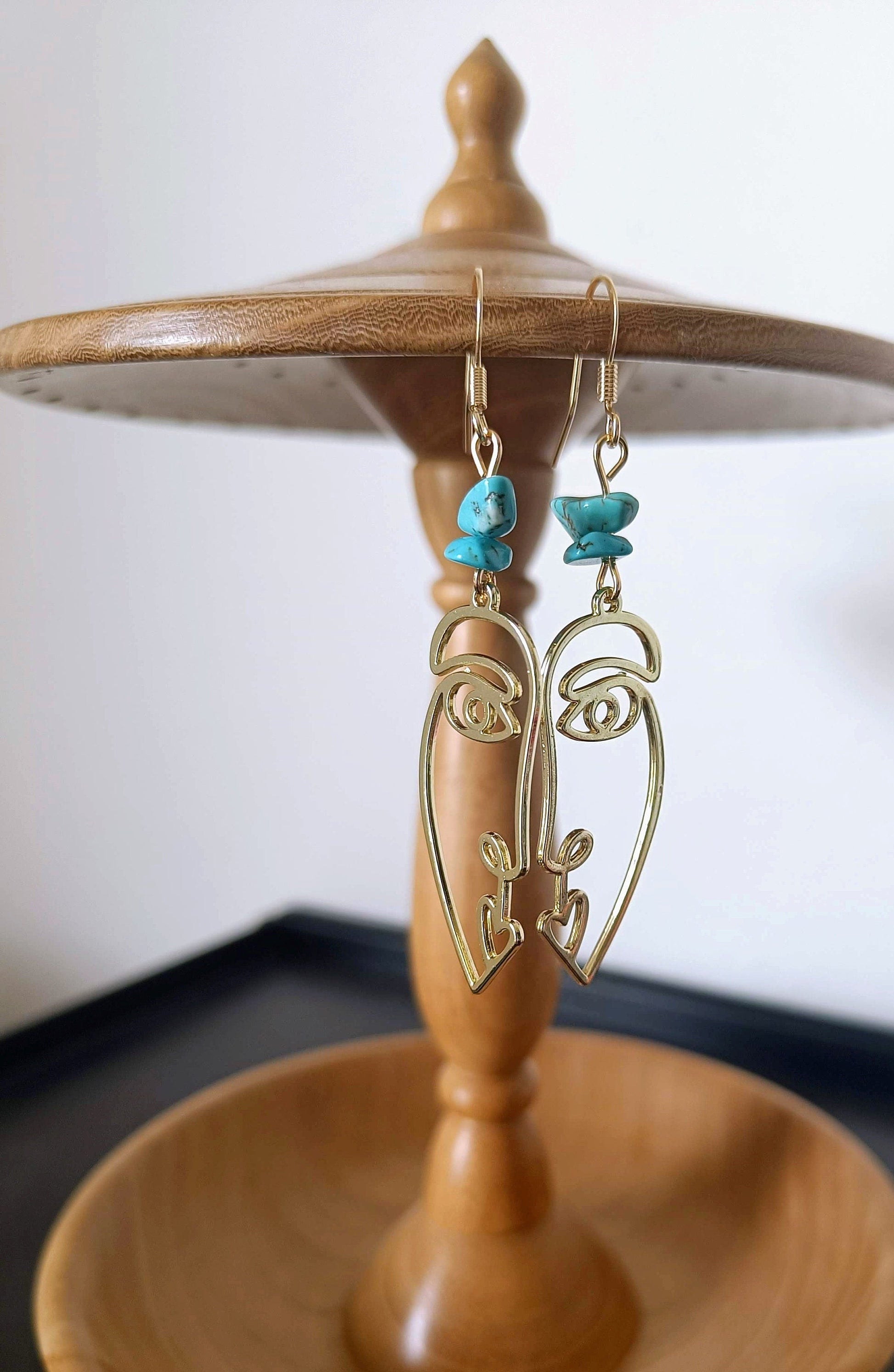 Turquoise abstract face earrings with repurposed turquoise chips and antique gold plate design.
