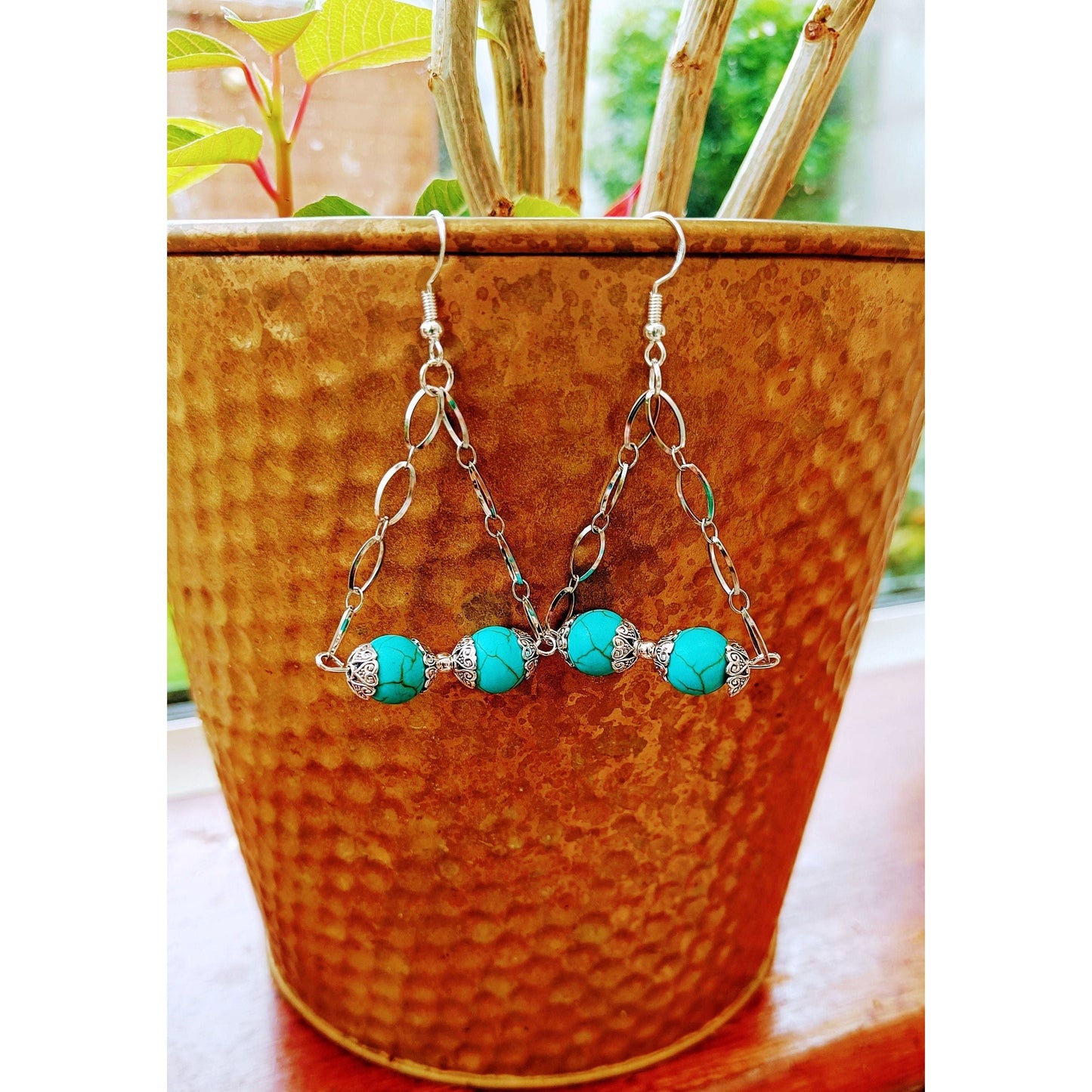 Silver and turquoise chandelier earrings with repurposed turquoise stone beads and stainless steel chain.