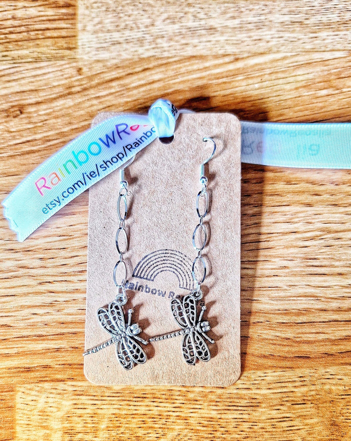 Long silver dragonfly earrings with stainless steel chain and charm, perfect for effortless style and everyday magic.