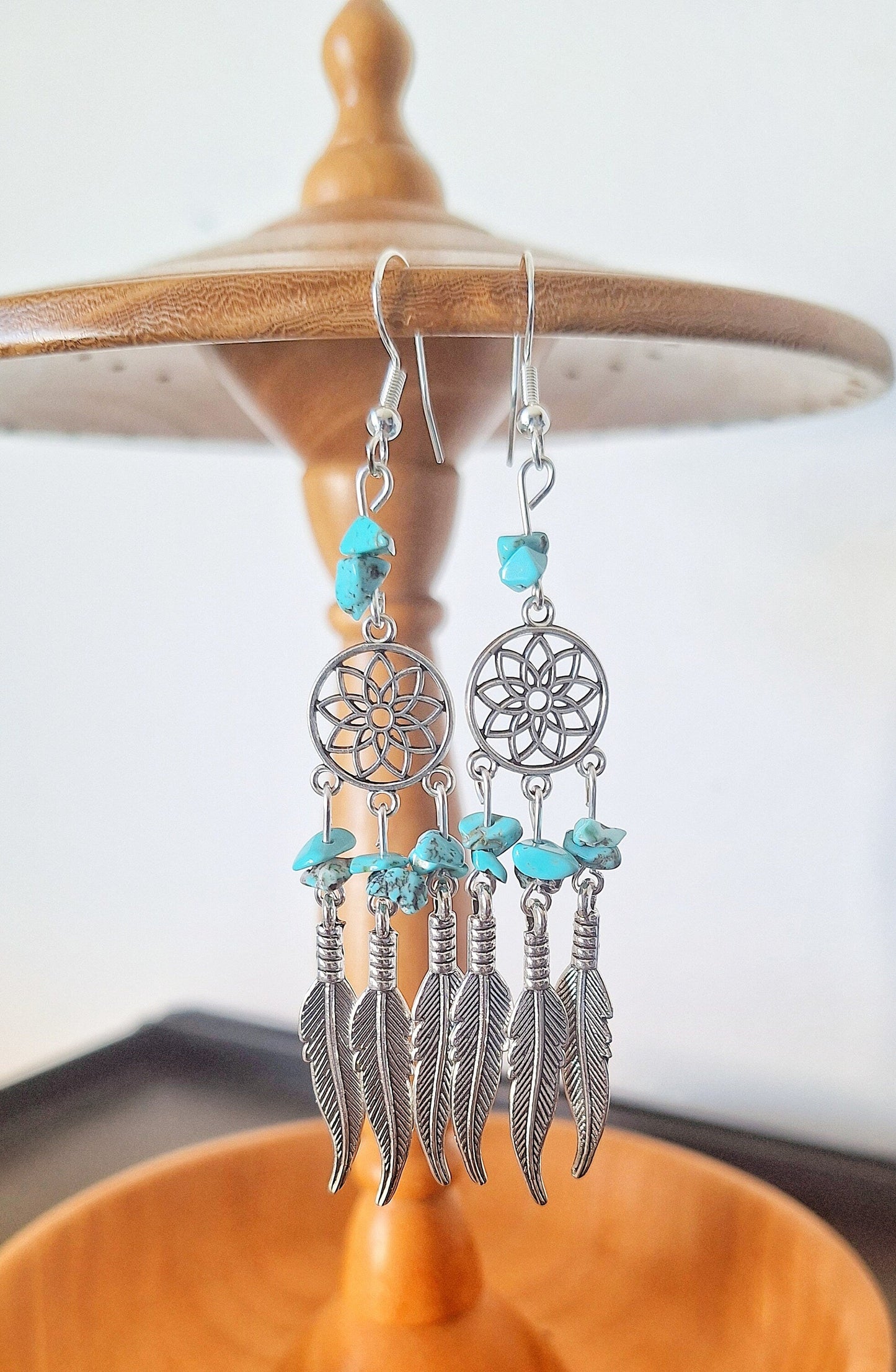 Turquoise Dream Catcher Earrings with genuine turquoise chips and feather charms on sterling silver hooks.