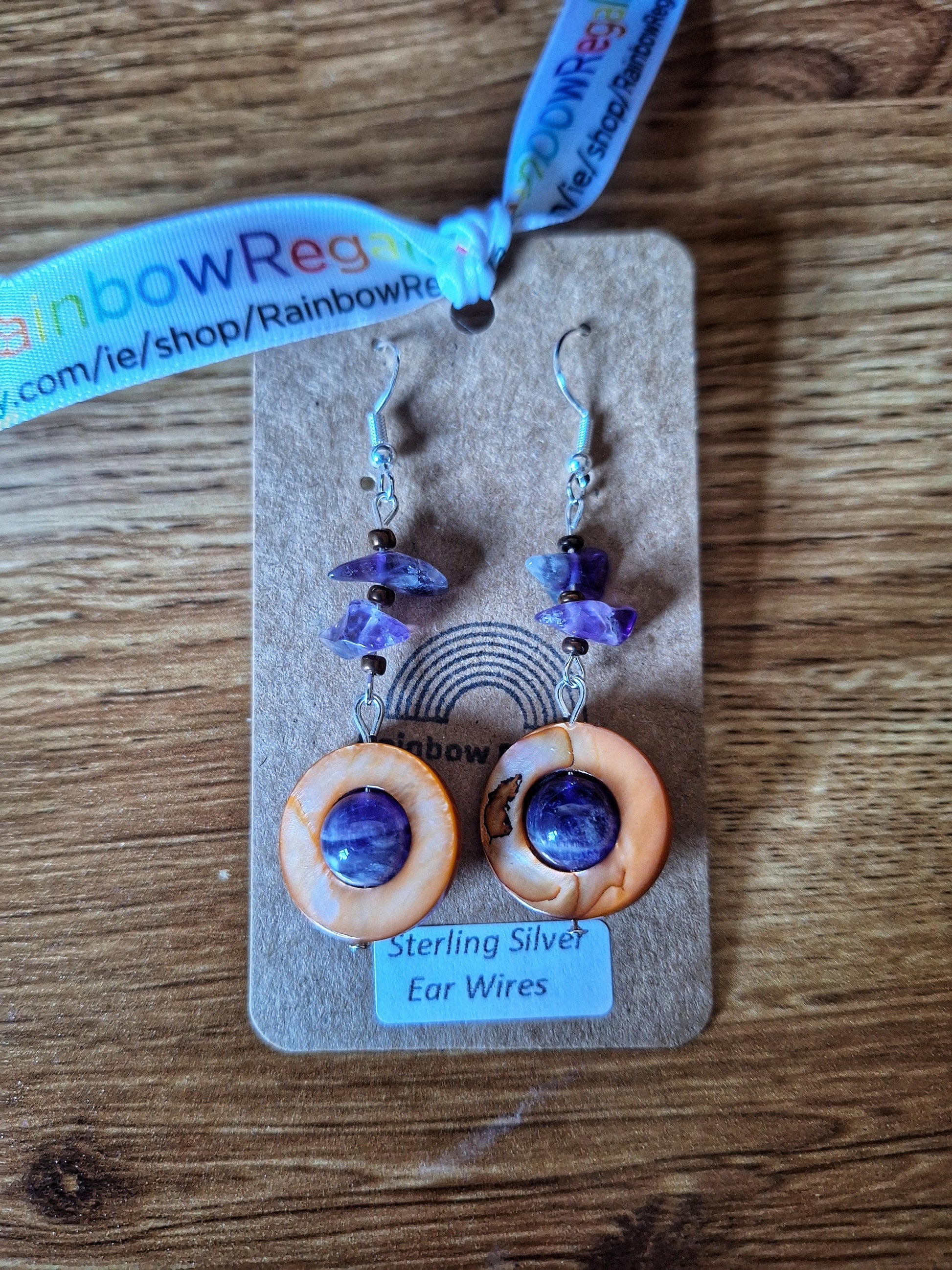 Jasmine Drop Earrings with amethyst chips, shell beads, and sterling silver wires.