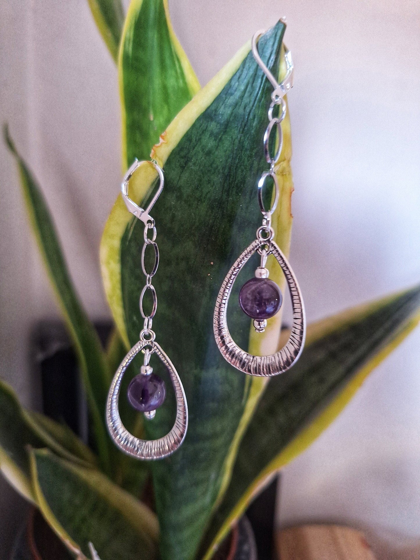 Elegant Iolanthe Drop Earrings with amethyst stone teardrop pendant.
