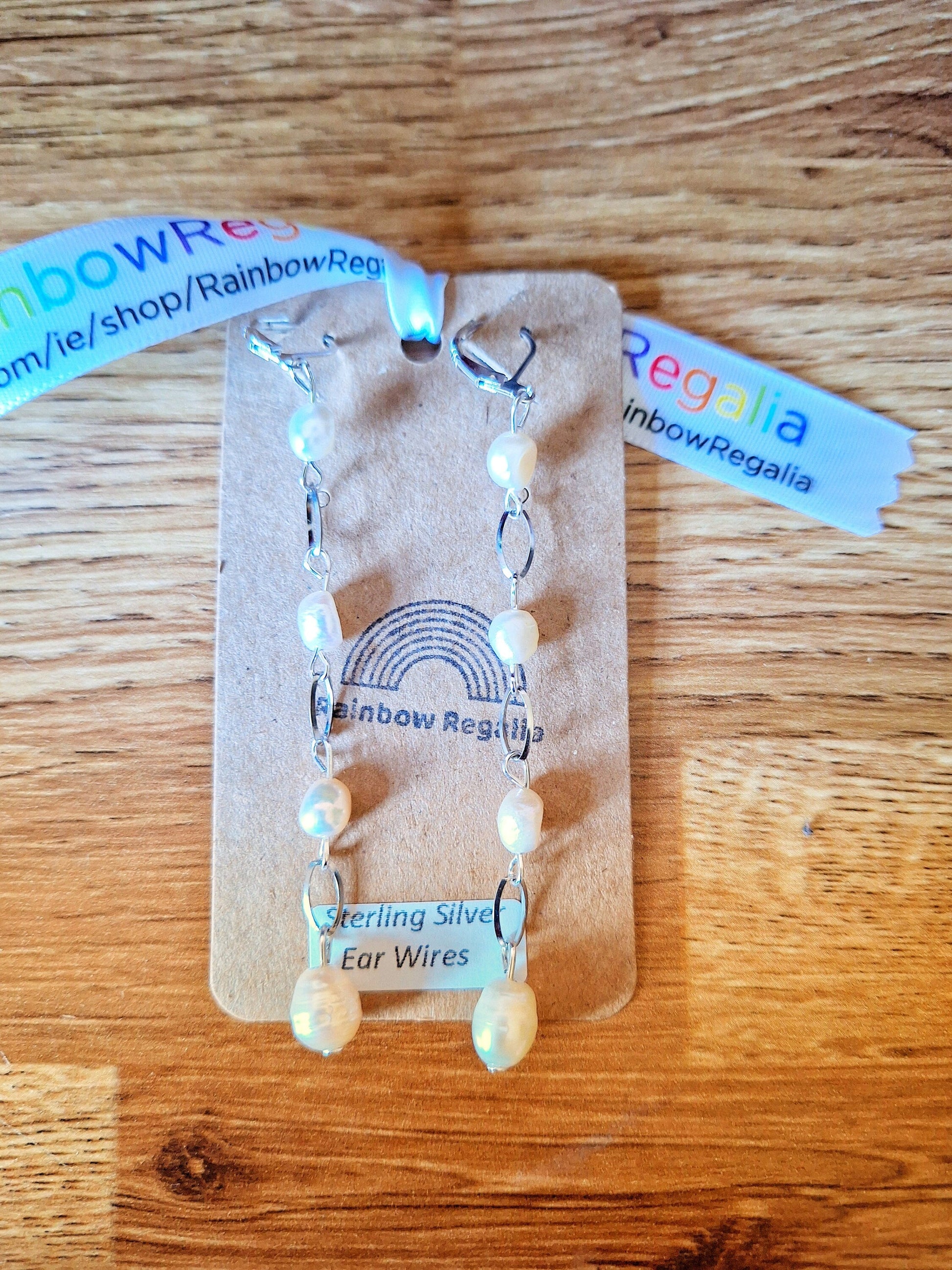 Vivienne Pearl Drop Earrings with sterling silver ear wires on display card.