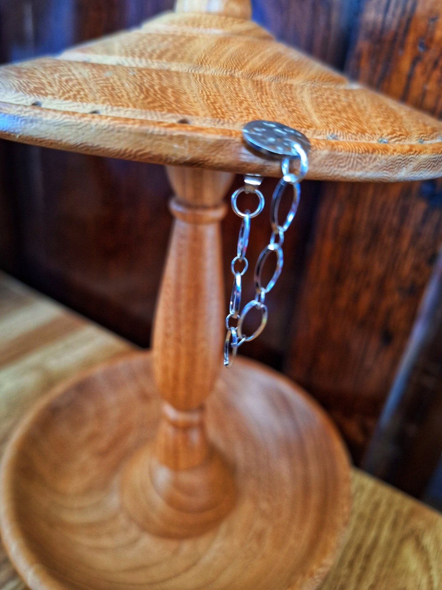 Siouxsie Chain Drop Earrings on wooden stand with stainless steel chain and silver disc stud.