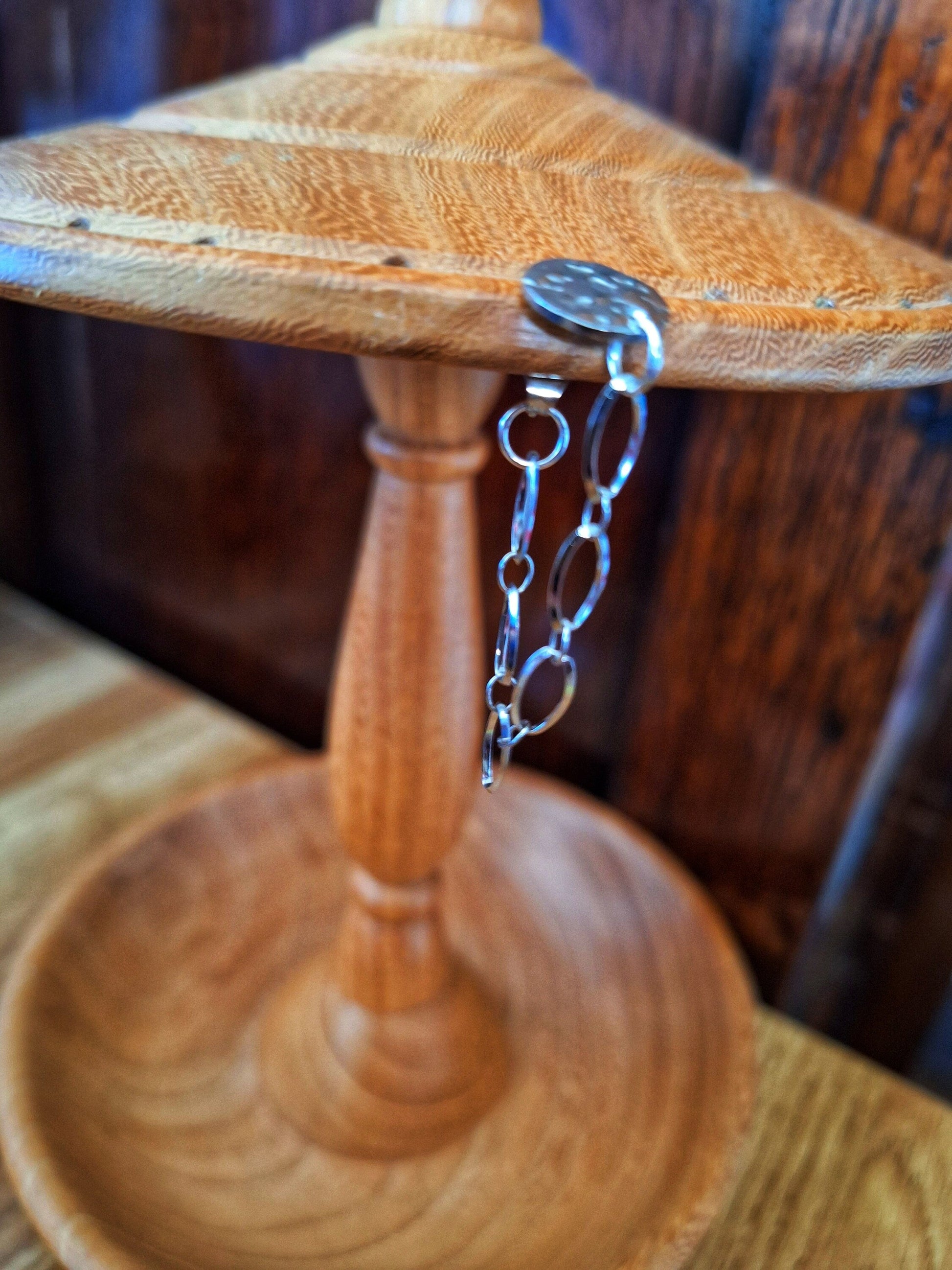 Siouxsie Chain Drop Earrings on wooden stand with stainless steel chain and silver disc stud.