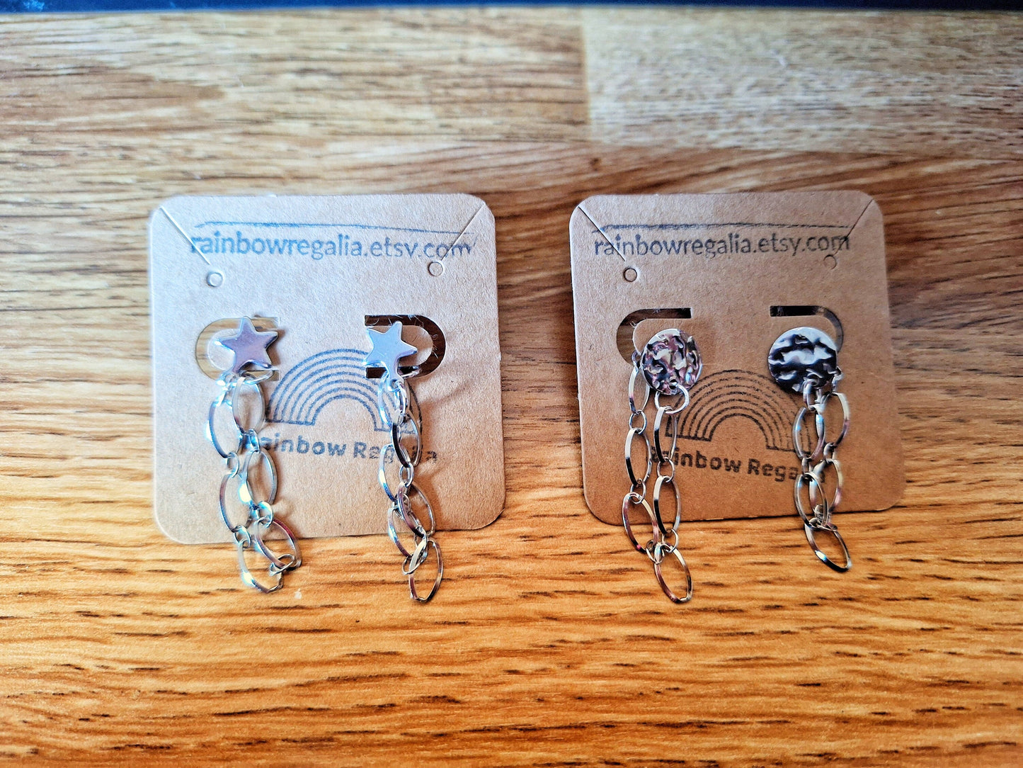 Eco-friendly Siouxsie Chain Drop Earrings with silver star and disc studs, crafted from repurposed stainless steel.