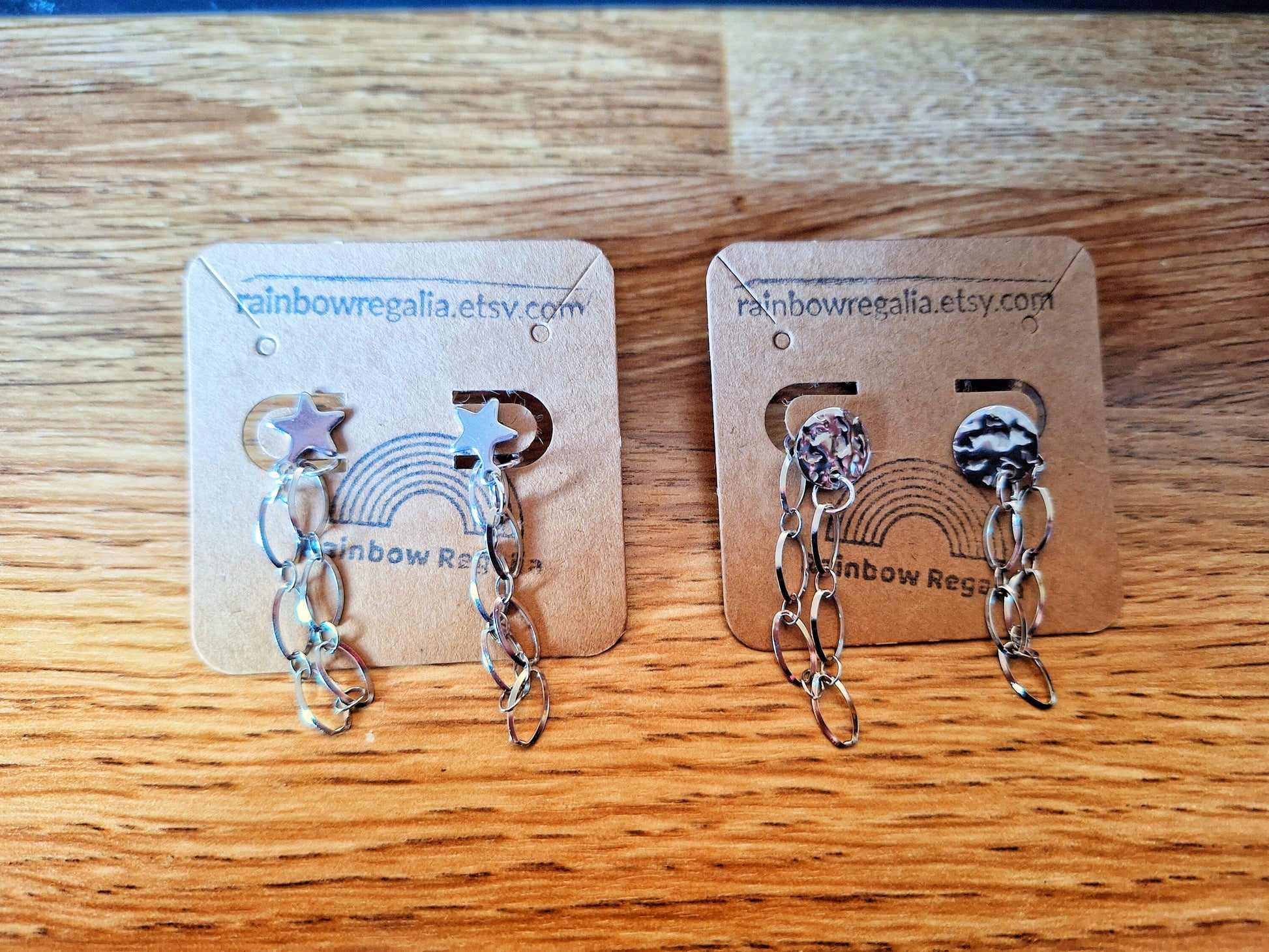 Eco-friendly Siouxsie Chain Drop Earrings with silver star and disc studs, crafted from repurposed stainless steel.