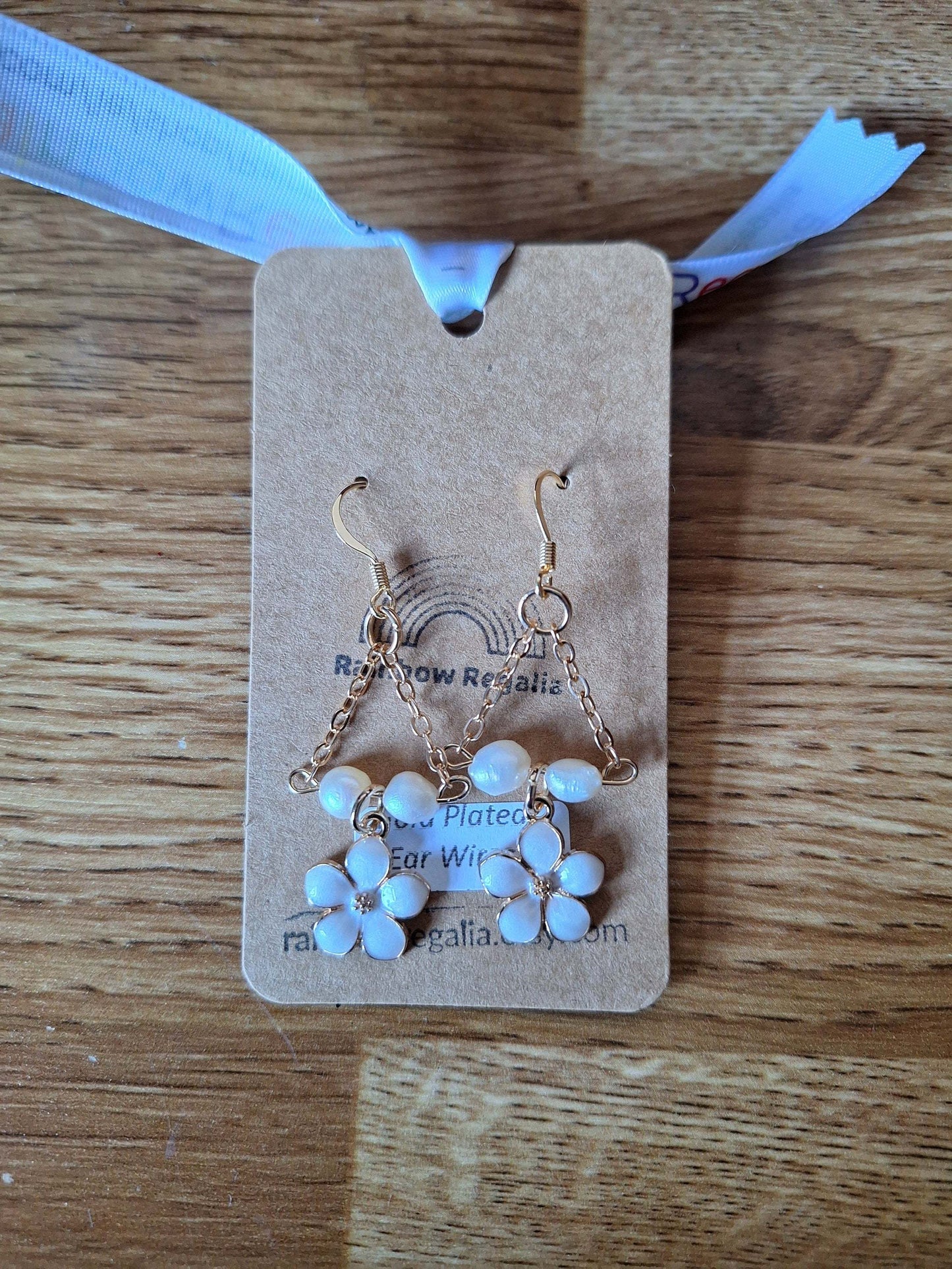 Naomi Cherry Blossom Pearl Earrings with repurposed pearls and gold-plated chain on display card.