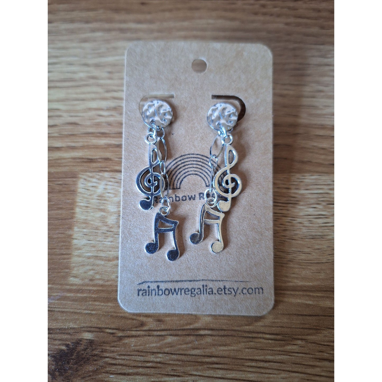 Aida Musical Chain Drop Earrings with antique silver-plated treble clef and note charms on card.