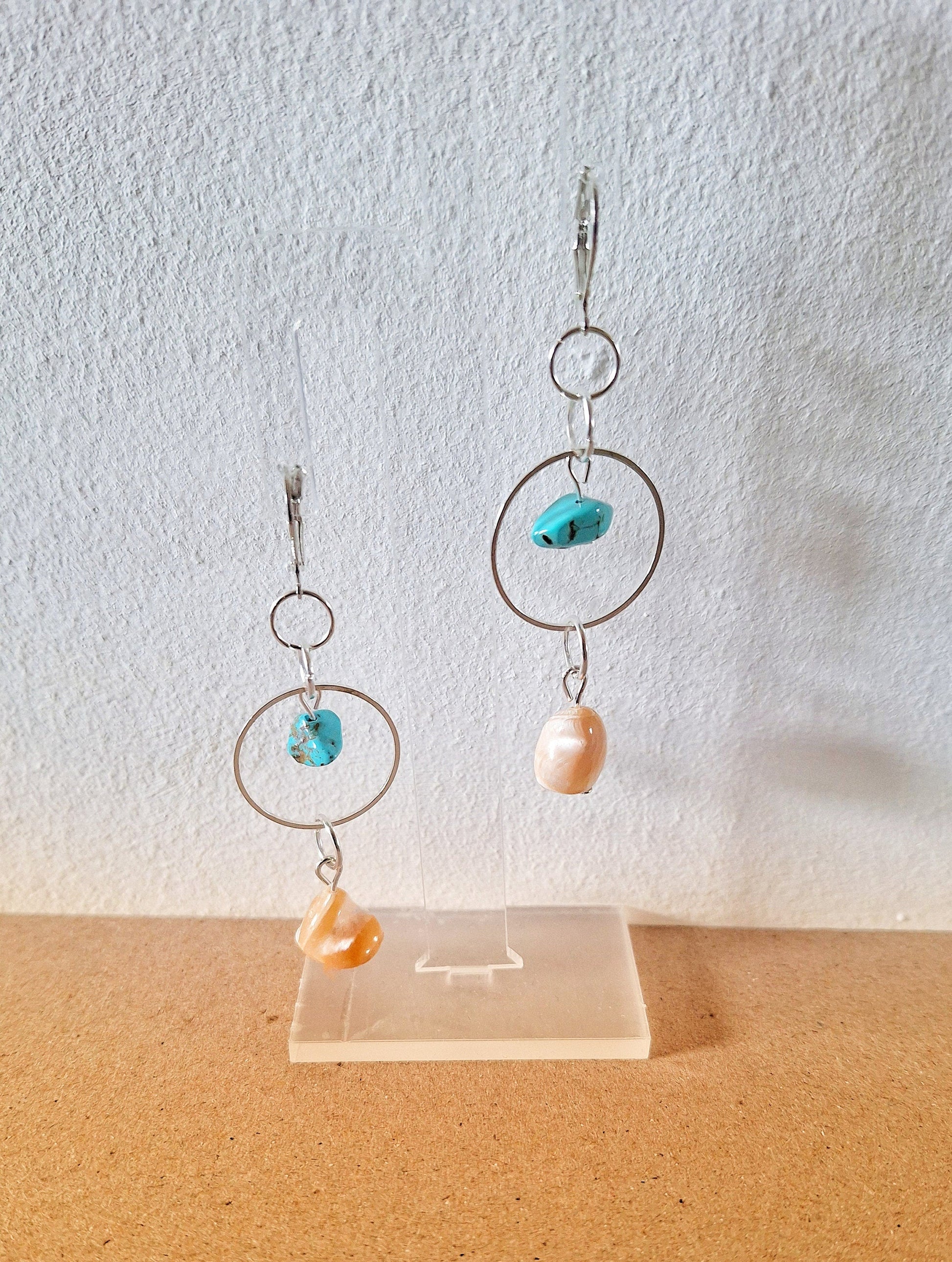 Isla Turquoise and Mother of Pearl Earrings featuring handcrafted turquoise and pearl accents on display.
