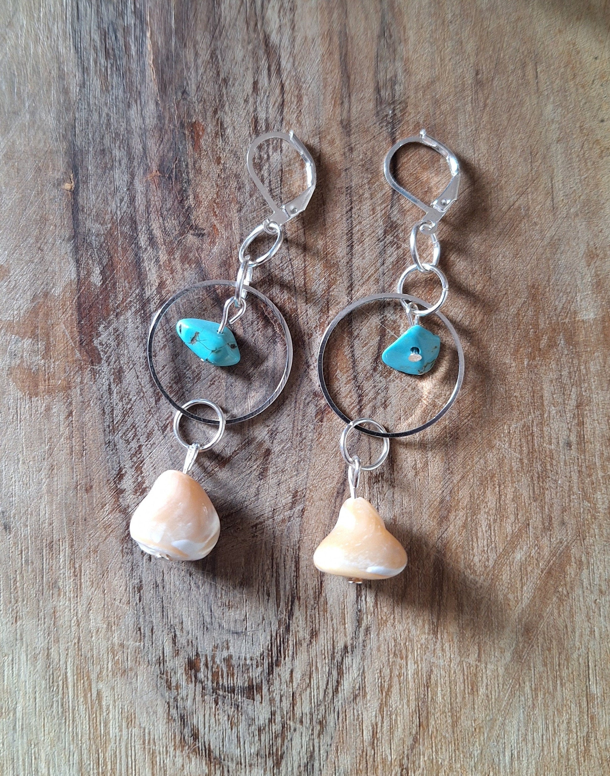 Handcrafted Isla Turquoise and Mother of Pearl Earrings with vibrant turquoise accents.