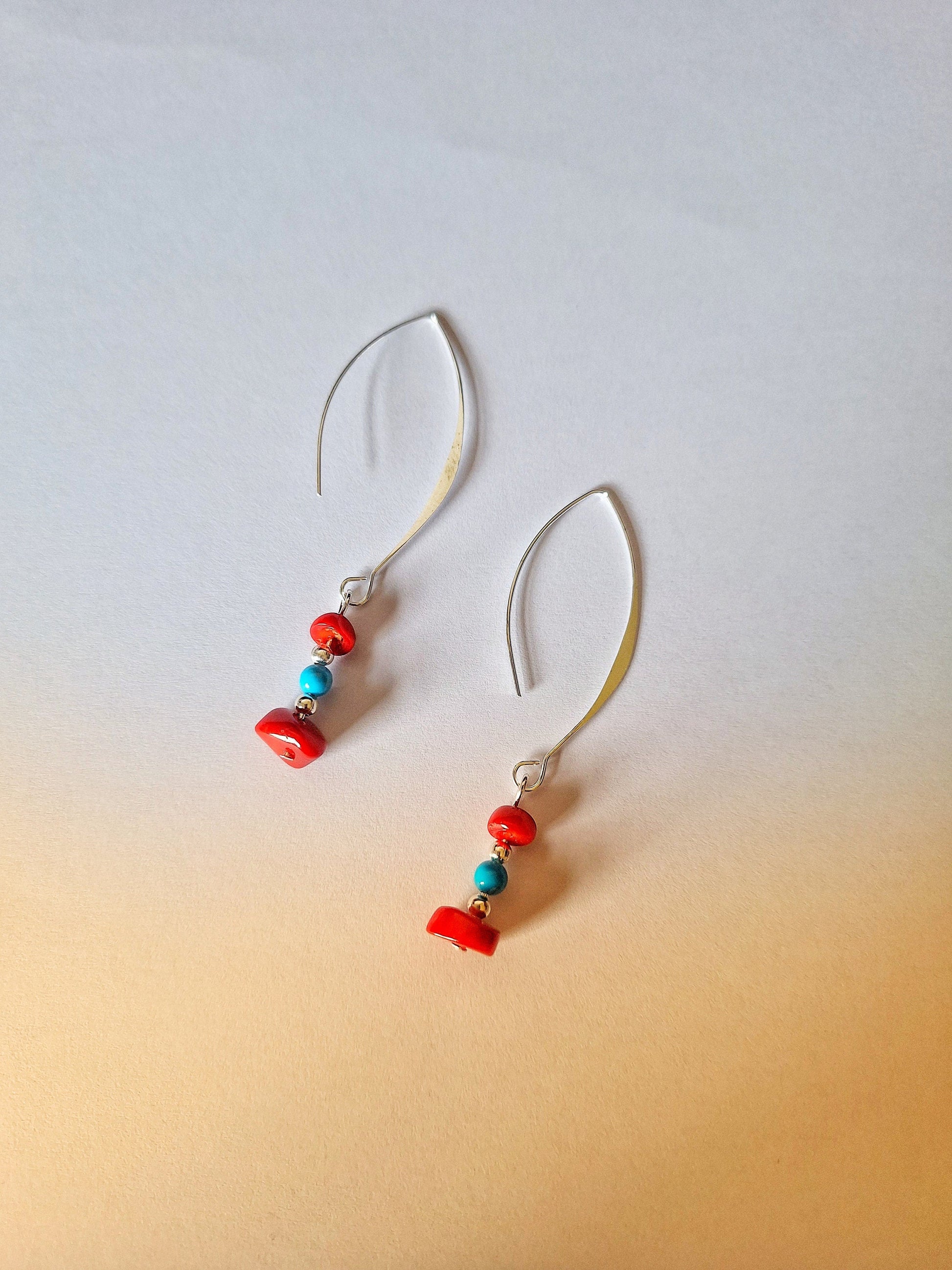 Kailani Coral Earrings with genuine coral and turquoise beads on silver-coloured hooks.