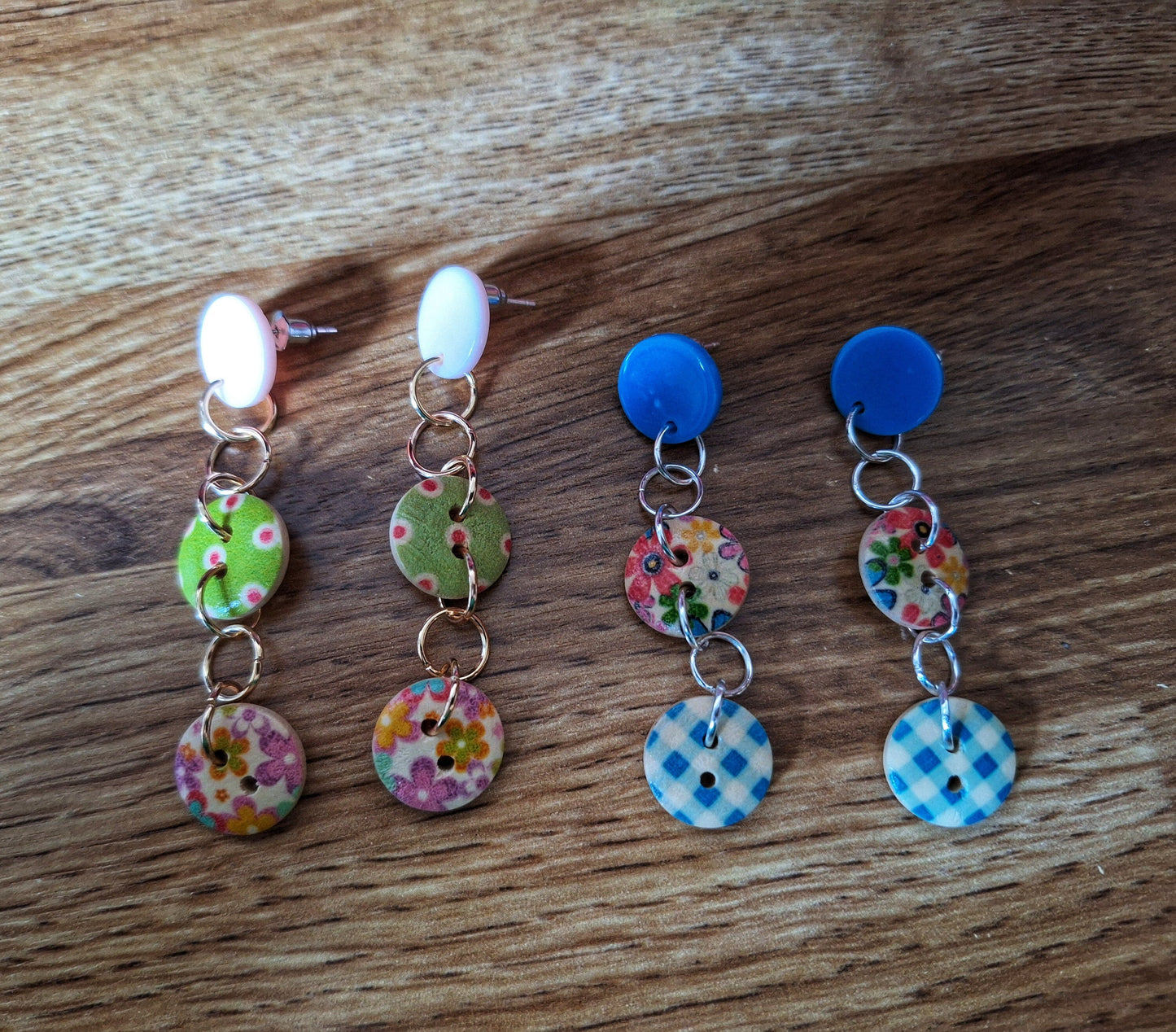 Bella Button Earrings in blue and pink with wooden buttons and acrylic discs.