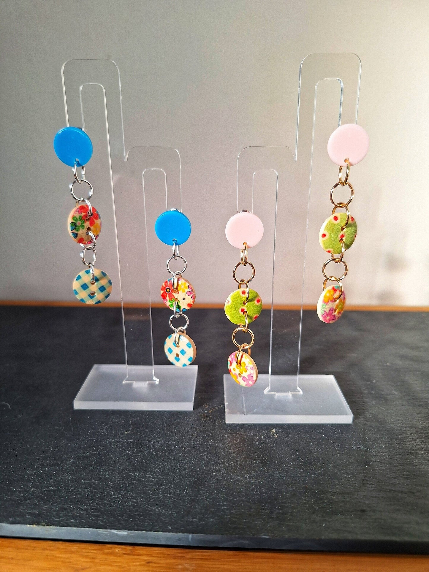 Bella Button Earrings in blue and pink with wooden buttons and acrylic discs.