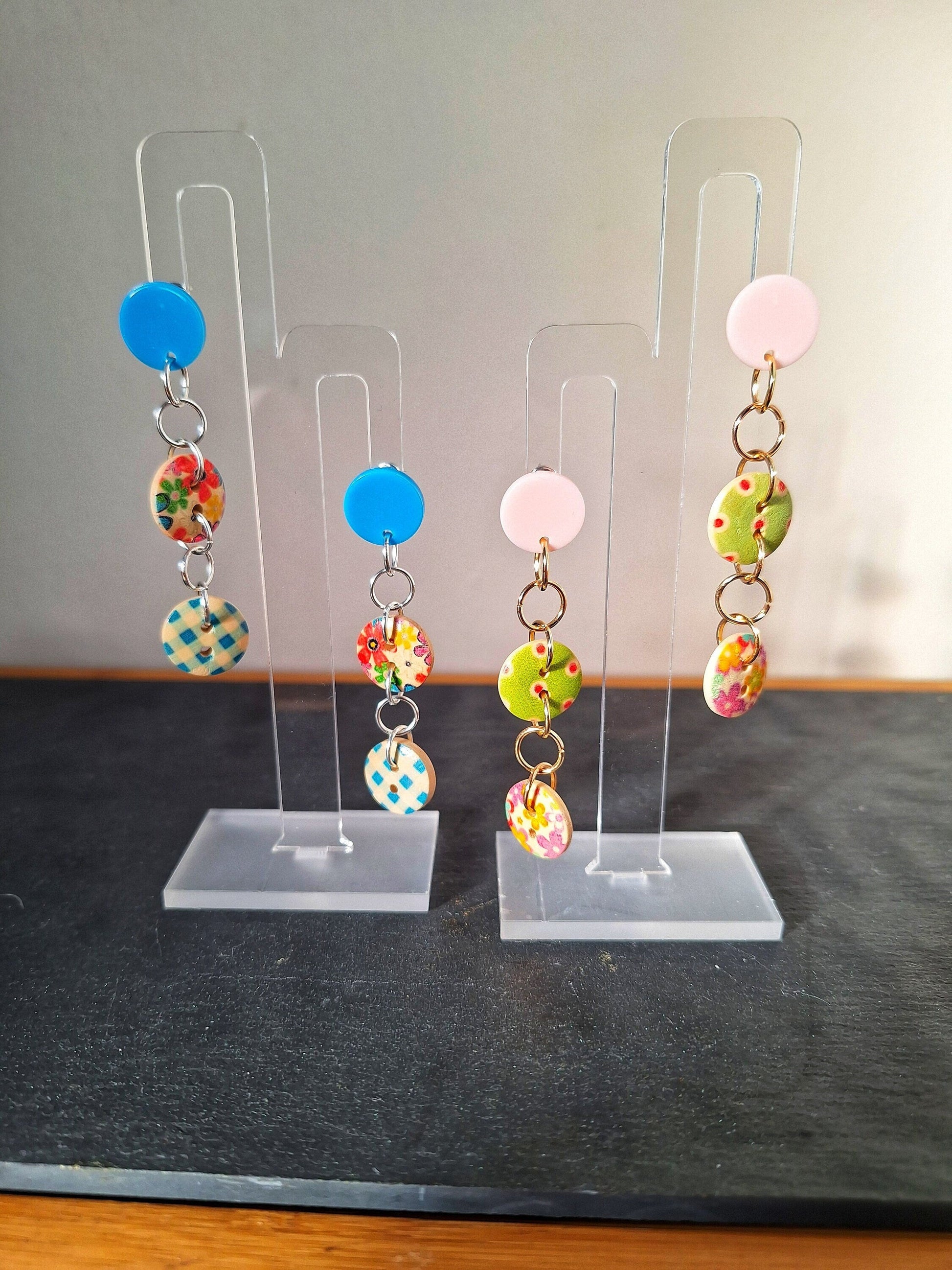 Bella Button Earrings in blue and pink with wooden buttons and acrylic discs.