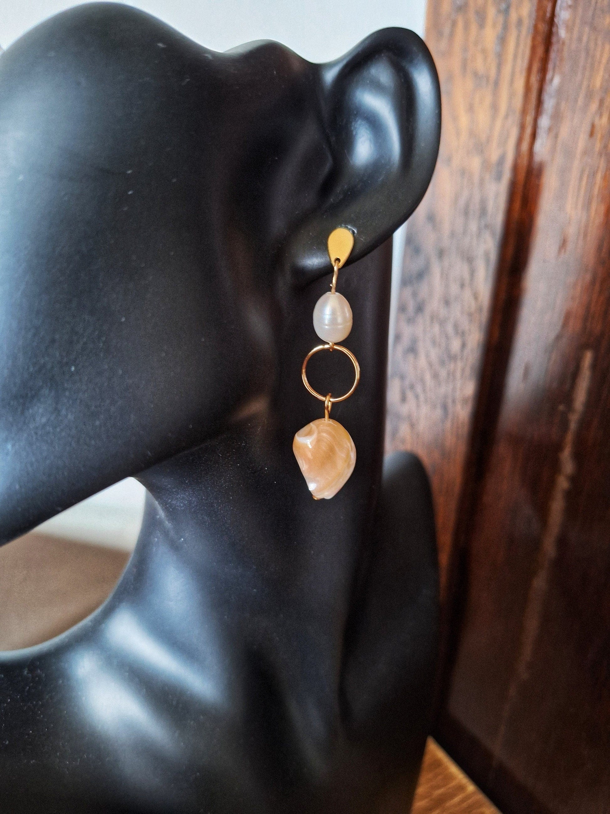 Isabella pearl earrings with repurposed freshwater pearls and mother of pearl shells dangling from gold-plated studs.