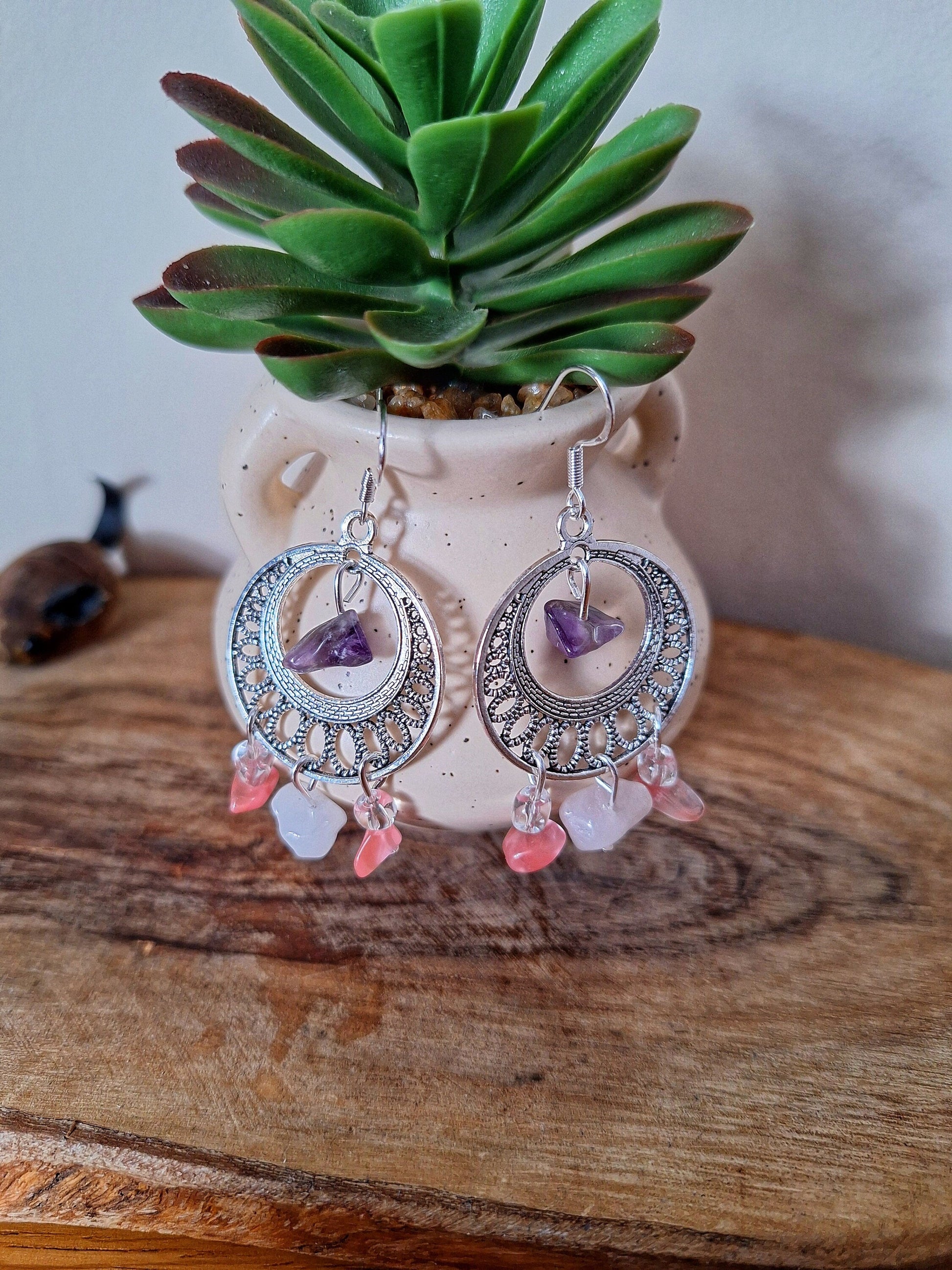 Eloise Chandelier Earrings with amethyst, pink, and white quartz chips crafted on sterling silver ear wires, displayed on a wooden surface.