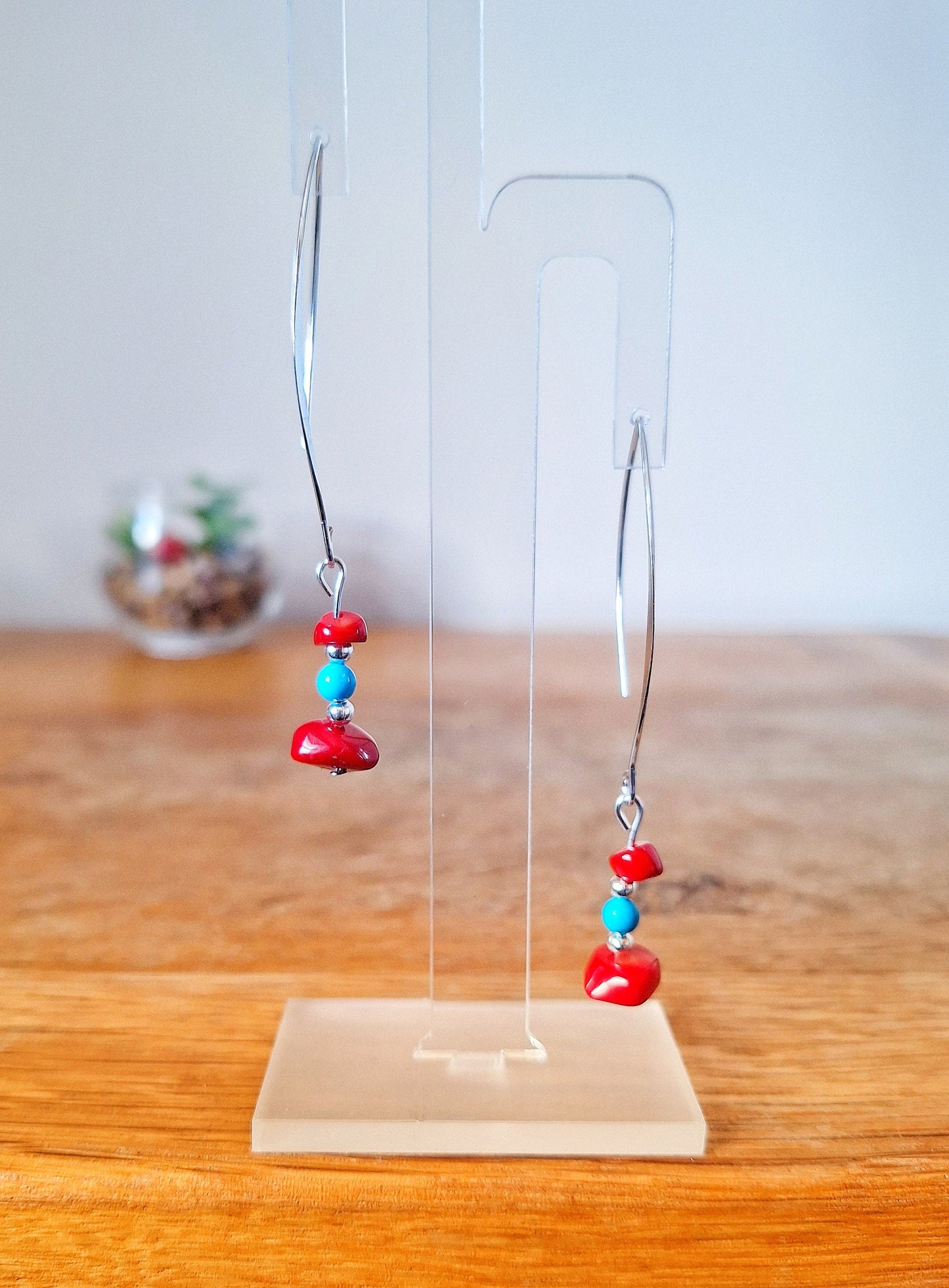 Kailani Coral Earrings with turquoise beads on silver colored hooks.