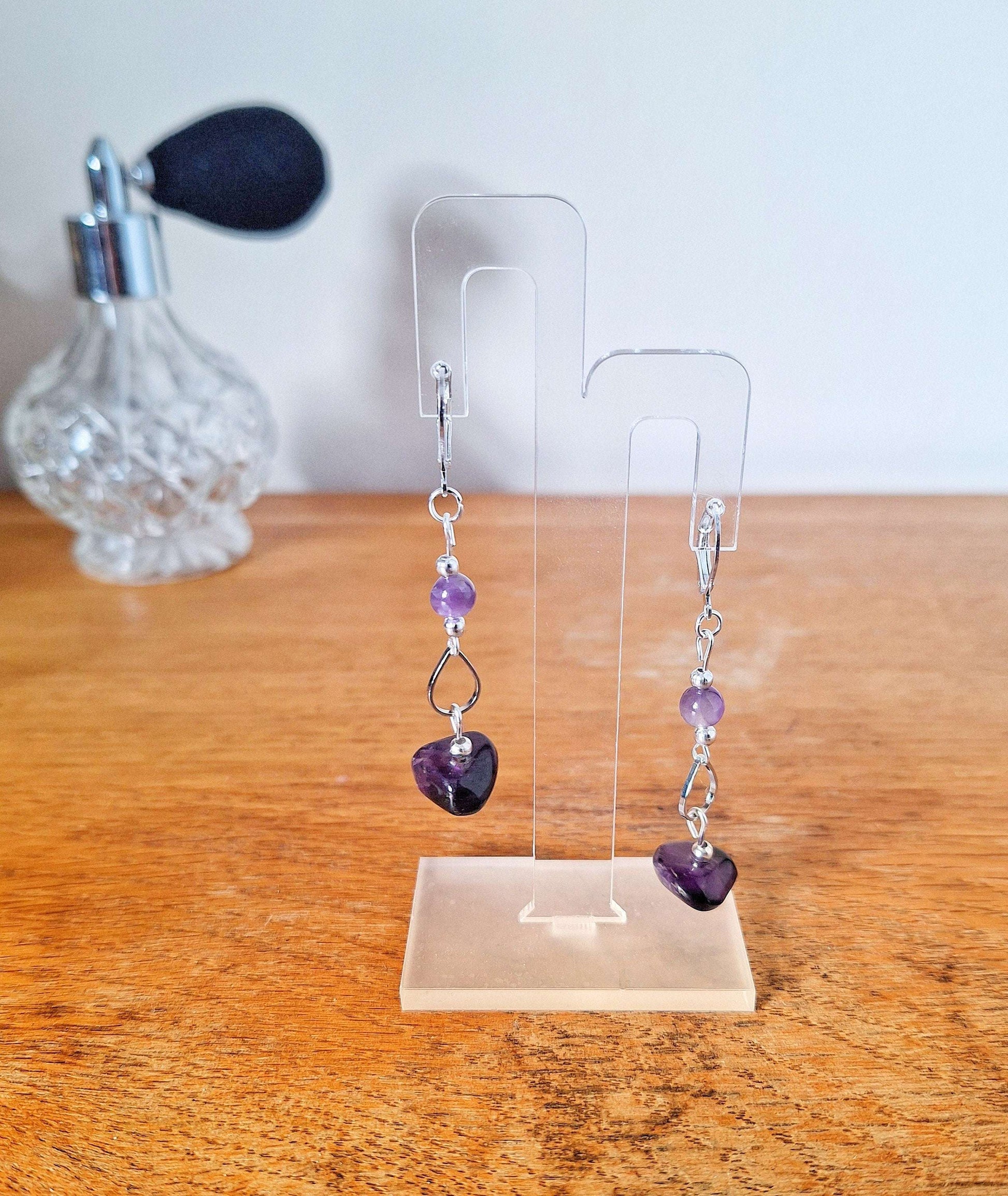 Francine Amethyst Earrings with silver-plated accents on display, featuring purple shimmer and sterling silver ear wires.