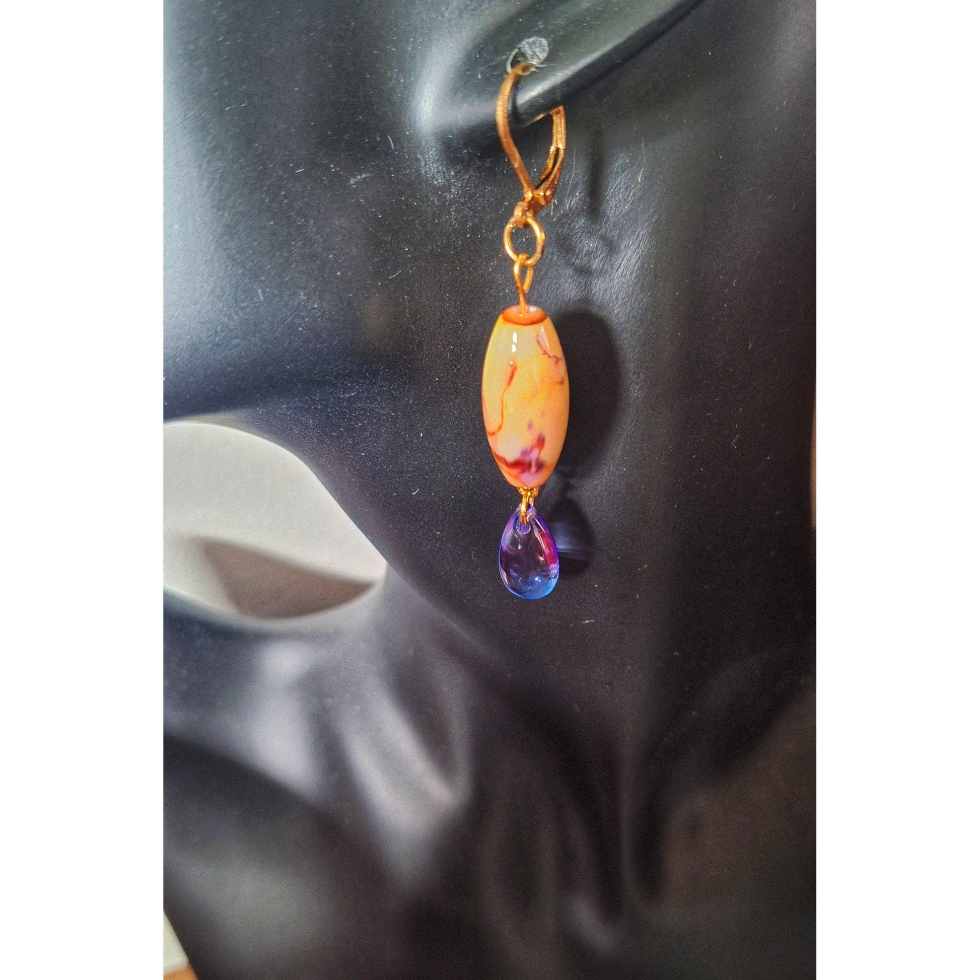 Lily Mismatched Earrings with purple and yellow glass beads on gold-plated lever back ear wires.