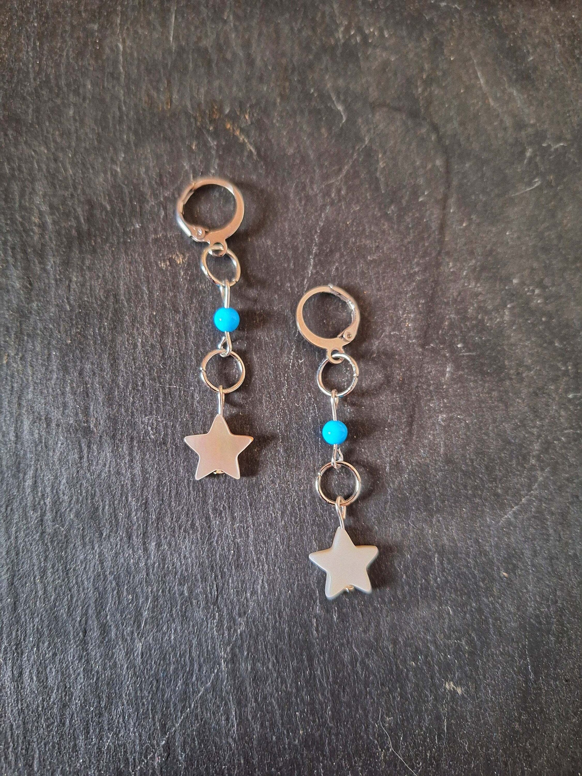 Cali Turquoise Star Earrings featuring mother of pearl star beads and turquoise stones on stainless steel hoops.