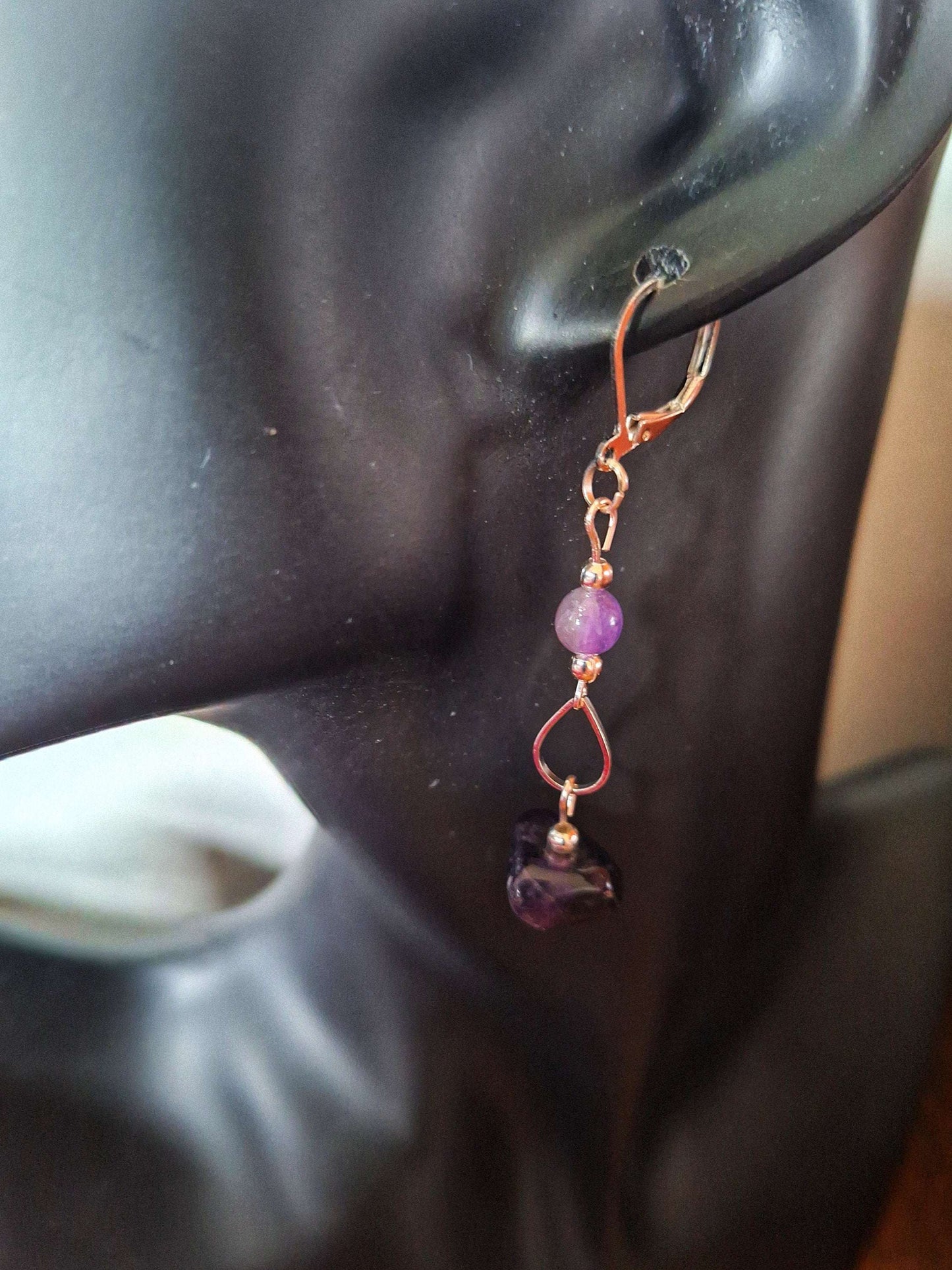 Francine Amethyst Earrings with silver-plated accents on mannequin ear.