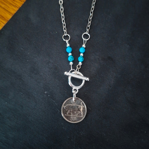 Necklace made using a genuine Irish 1996 5p coin, repurposed turquoise beads and suspended from a stainless steel chain. By RainbowRegalia, Greystones, Co Wicklow.