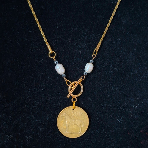 Necklace made with genuine Irish 1996 20p coin, repurposed freshwater pearls and hematite beads. Suspended from gold-plated chain. By RainbowRegalia, Greystones, Co Wicklow.