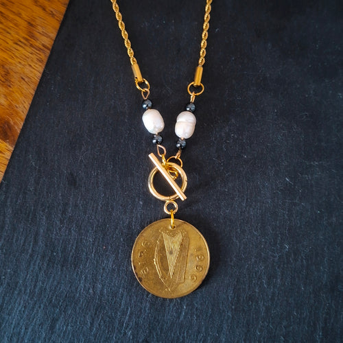 Necklace made with genuine Irish 1996 20p coin, repurposed freshwater pearls and hematite beads. Suspended from gold-plated chain. By RainbowRegalia, Greystones, Co Wicklow.