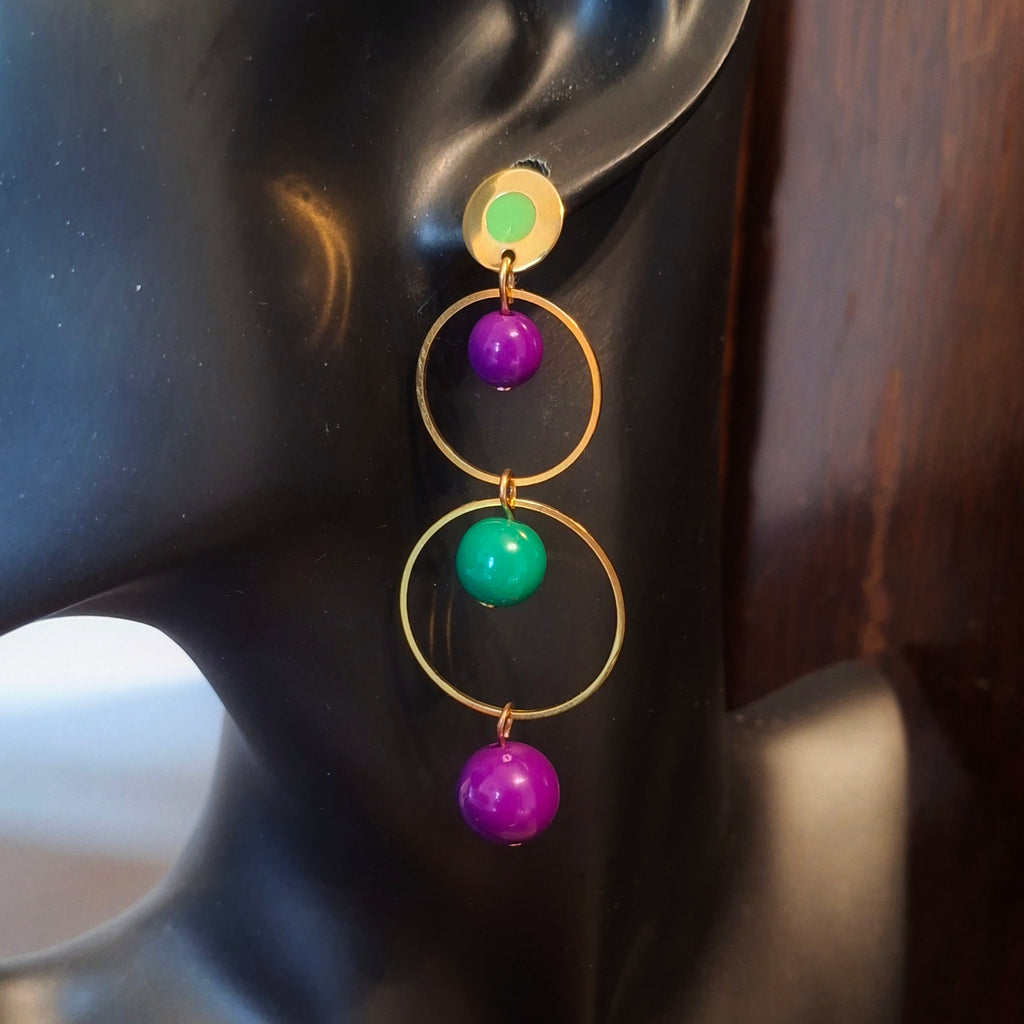 Gold earring with purple and green beads. Handmade by RainbowRegalia, Greystones, Co. Wicklow.