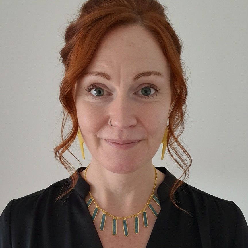 Eleanor wearing handmade teal geometric gold-plated necklace by RainbowRegalia, Greystones, Co. Wicklow.