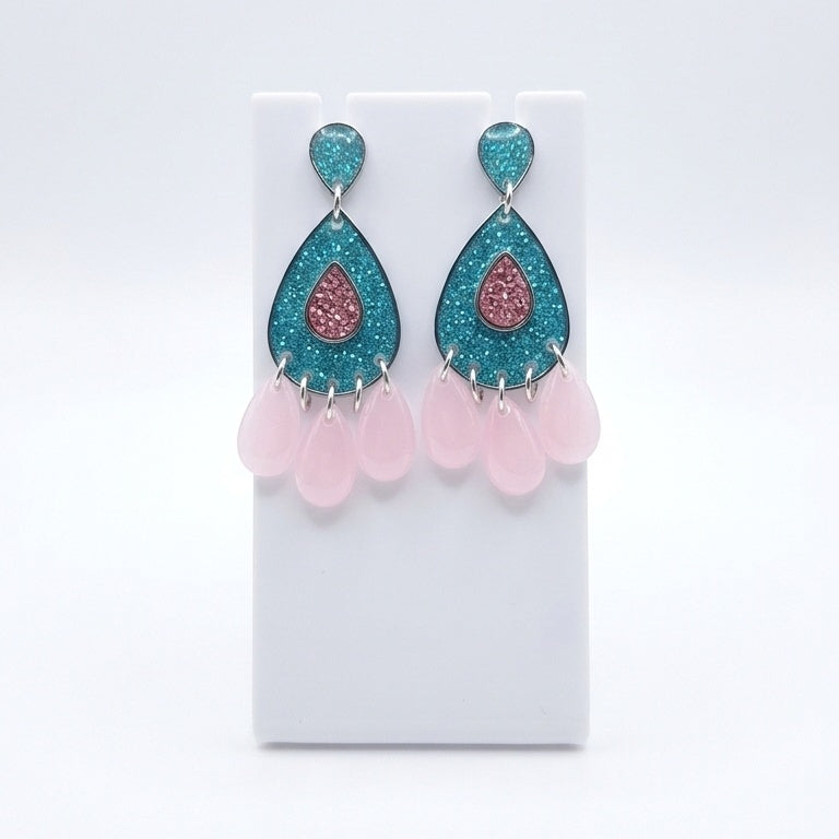 Teal and pink teardrop chandelier earrings.