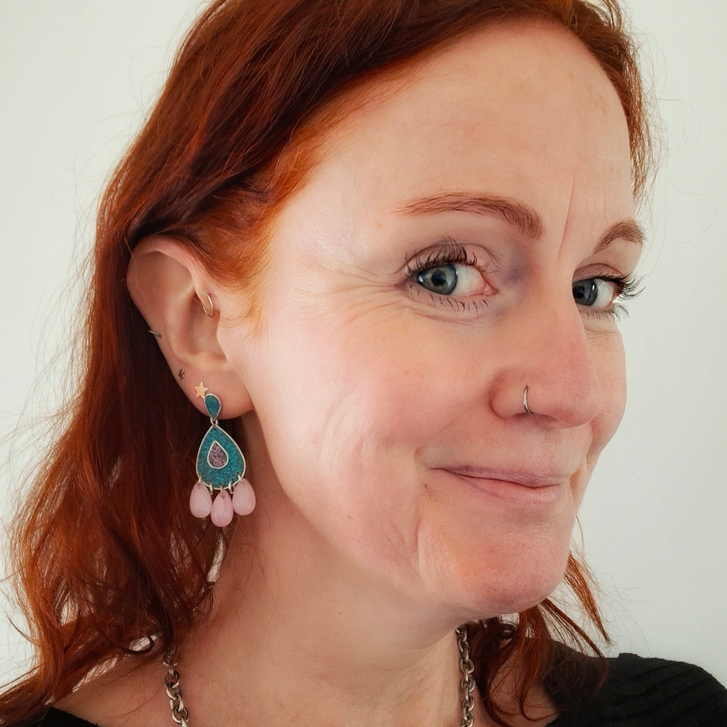 Teal and pink teardrop chandelier earrings.