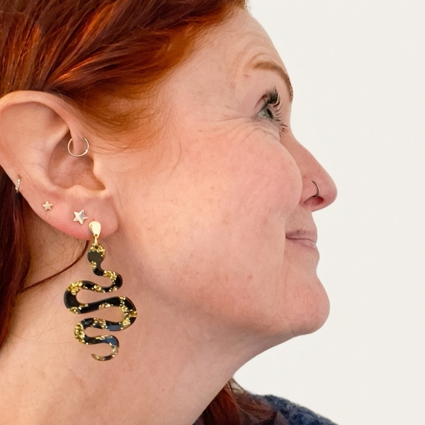 Handmade Black & Gold Resin Snake Earrings. Made in Wicklow by RainbowRegalia.