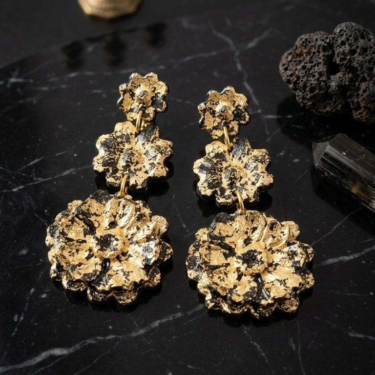 Long black 3 flower black and gold statement earrings.