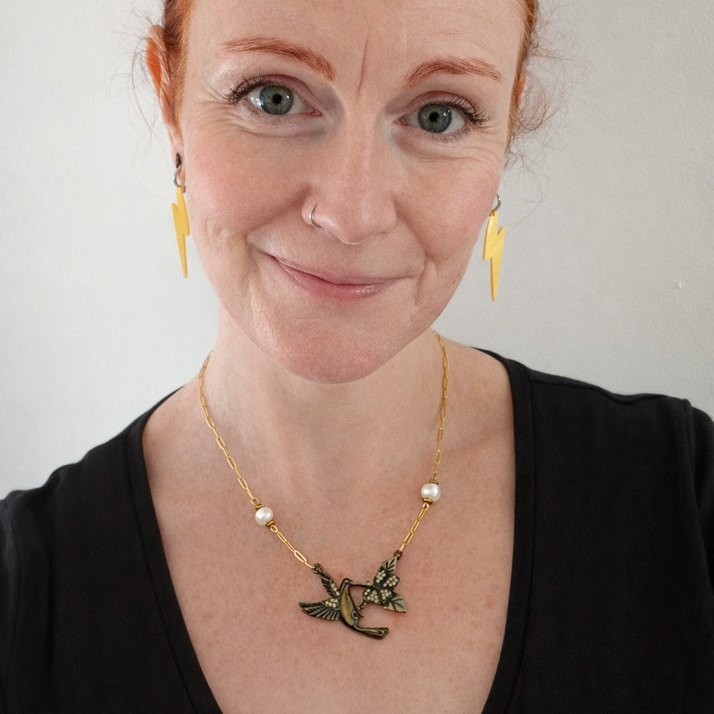 Hummingbird necklace with pearls on a gold chain