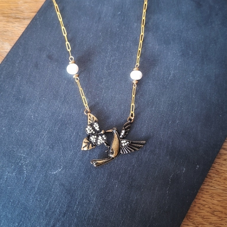 Hummingbird necklace with pearls on a gold chain