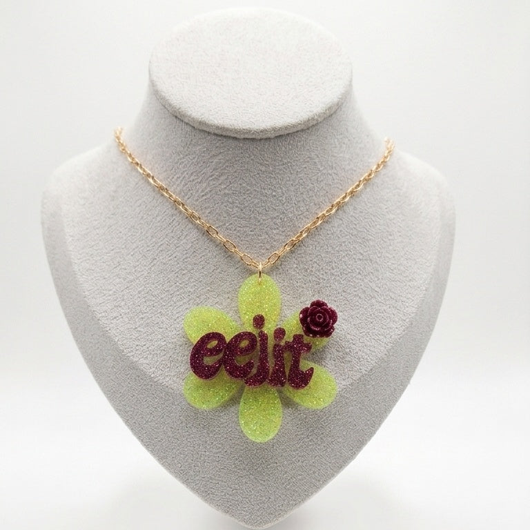 Lime green flower pendant with word 'eejit'.