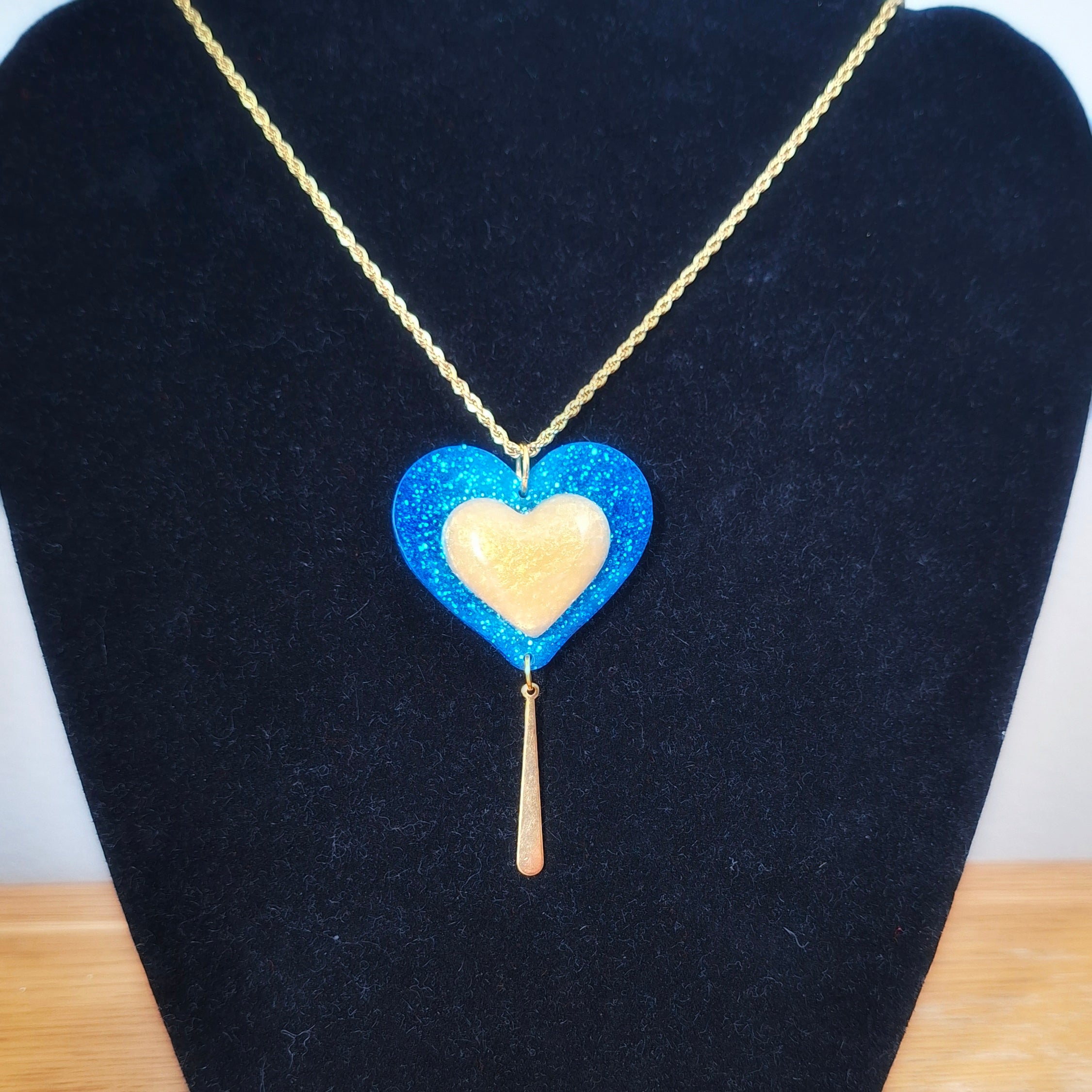 Blue and gold heart necklace on a gold-plated rope chain