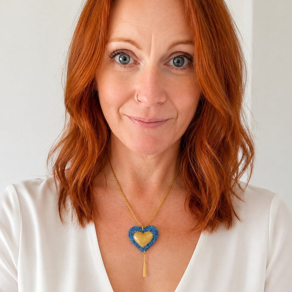 Blue and gold heart necklace on a gold-plated rope chain