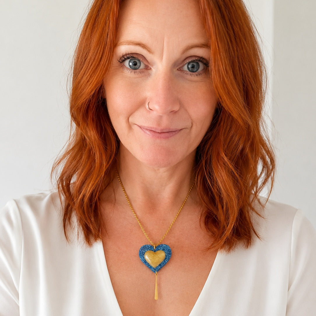 Blue and gold heart necklace on a gold-plated rope chain