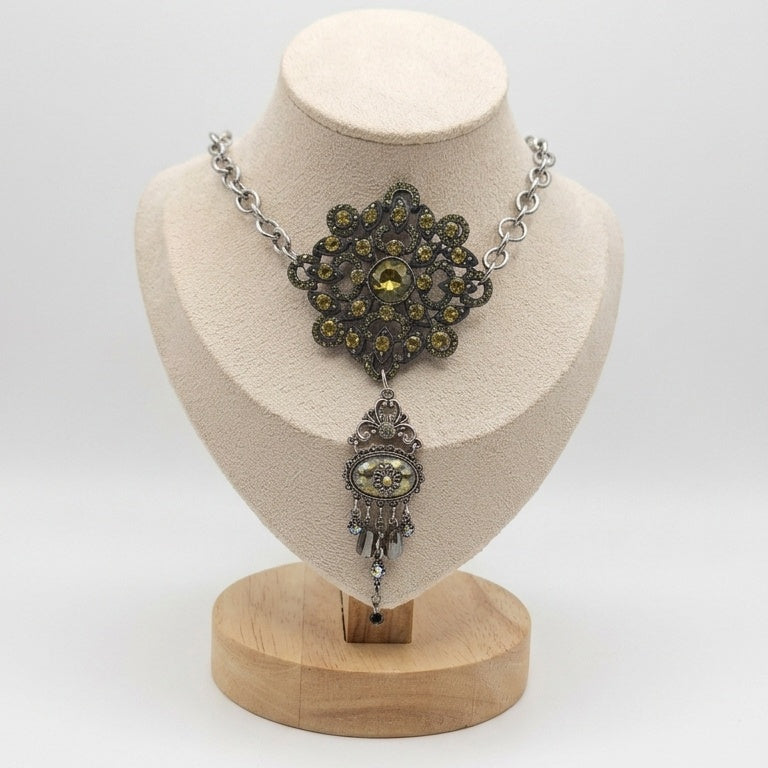 A gothic statement piece upcycled from a vintage rhinestone brooch and H. Dubin elements.