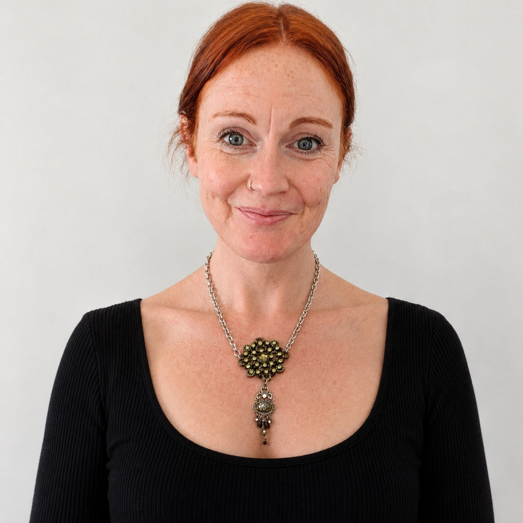 A gothic statement piece upcycled from a vintage rhinestone brooch and H. Dubin elements.