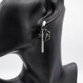 Black resin floral drop earrings with gold foil, handmade in Ireland