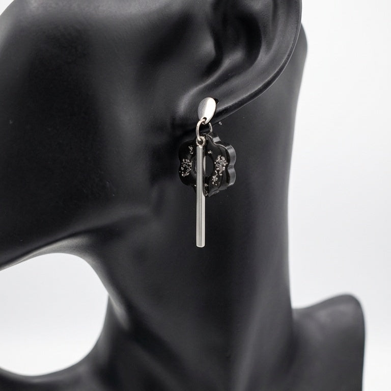 Black resin floral drop earrings with gold foil, handmade in Ireland