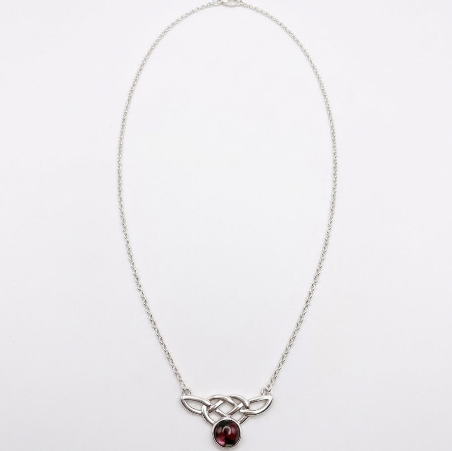 Scottish Heathergems necklace with sterling silver Celtic knotwork and a round red-and-green heather cabochon on a silver chain.